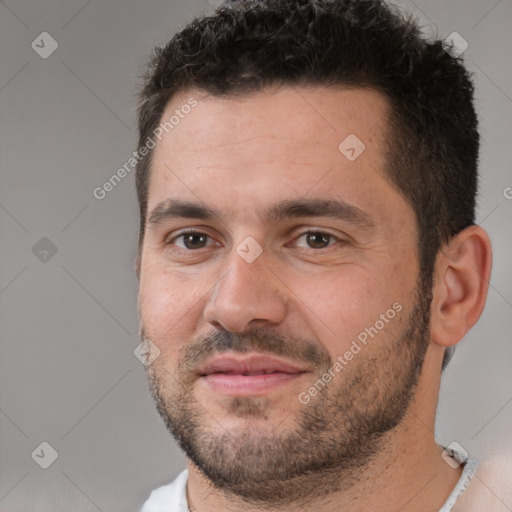 Joyful white adult male with short  brown hair and brown eyes