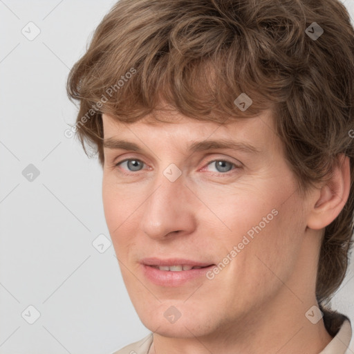 Joyful white adult male with short  brown hair and grey eyes