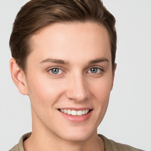 Joyful white young-adult female with short  brown hair and grey eyes