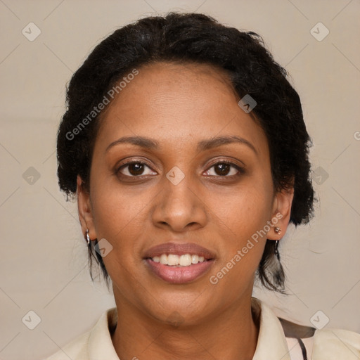 Joyful black adult female with medium  brown hair and brown eyes