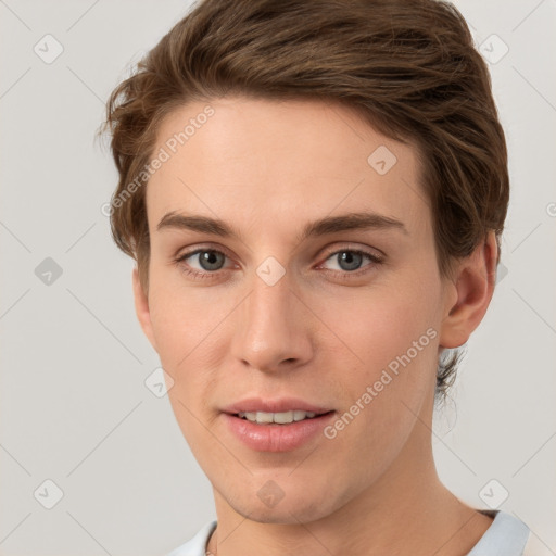 Joyful white young-adult female with short  brown hair and grey eyes