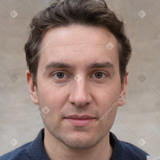 Joyful white adult male with short  brown hair and grey eyes