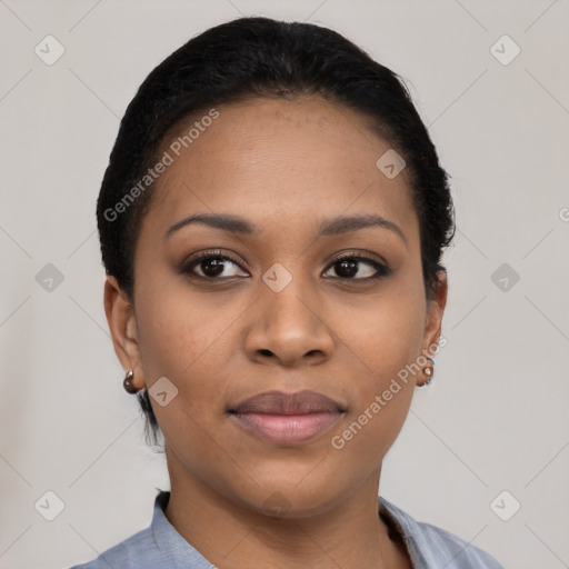 Joyful black young-adult female with short  black hair and brown eyes