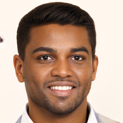 Joyful black young-adult male with short  black hair and brown eyes