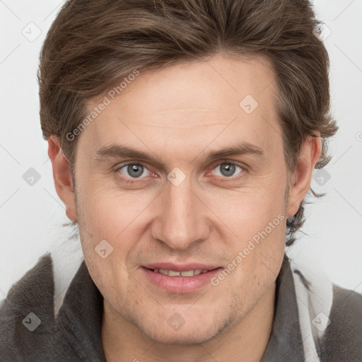 Joyful white adult male with short  brown hair and grey eyes