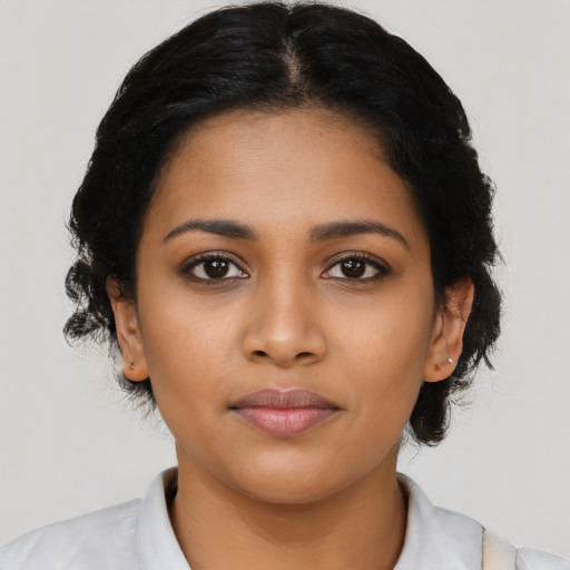 Joyful latino young-adult female with medium  black hair and brown eyes
