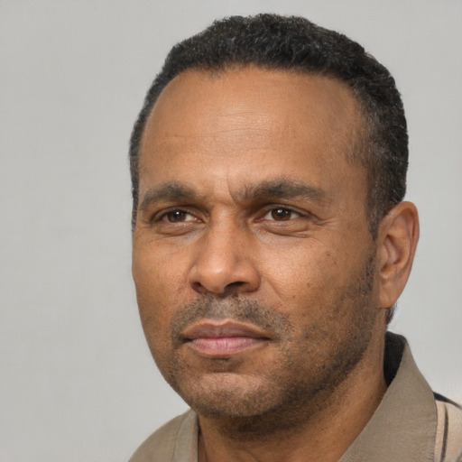 Neutral latino adult male with short  black hair and brown eyes