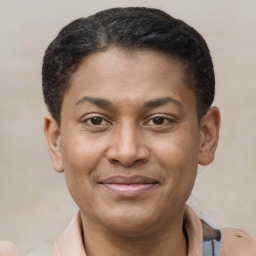 Joyful latino young-adult male with short  brown hair and brown eyes