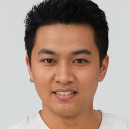 Joyful asian young-adult male with short  black hair and brown eyes