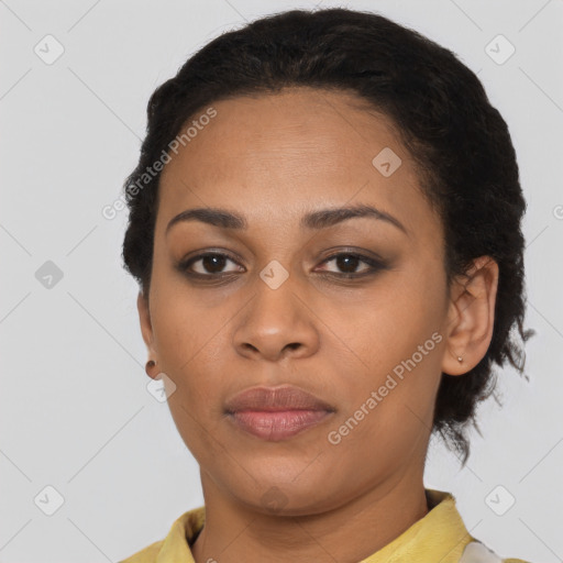 Joyful latino young-adult female with short  brown hair and brown eyes