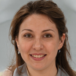 Joyful white adult female with medium  brown hair and brown eyes