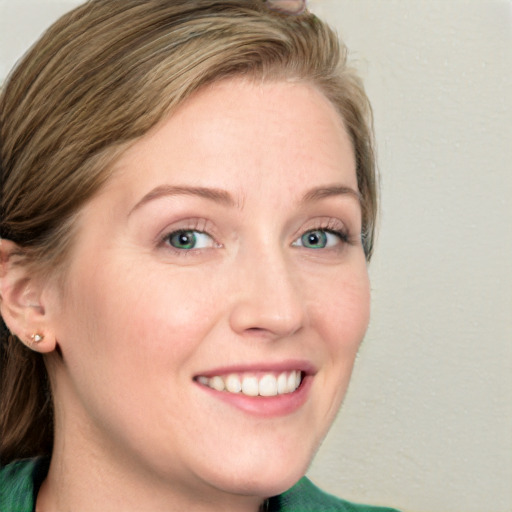 Joyful white young-adult female with medium  brown hair and blue eyes