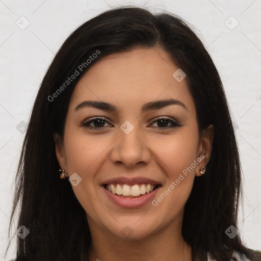 Joyful latino young-adult female with long  brown hair and brown eyes