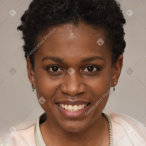 Joyful black young-adult female with short  brown hair and brown eyes