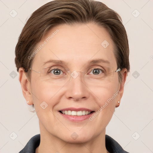 Joyful white adult female with short  brown hair and grey eyes