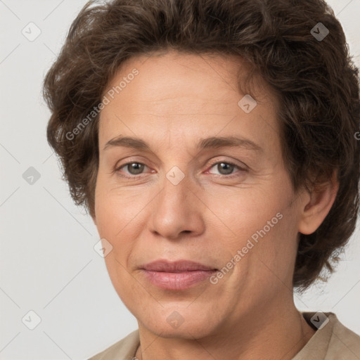 Joyful white adult female with short  brown hair and grey eyes