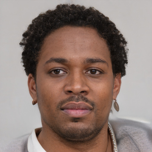 Neutral latino young-adult male with short  brown hair and brown eyes