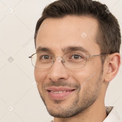 Joyful white adult male with short  brown hair and brown eyes