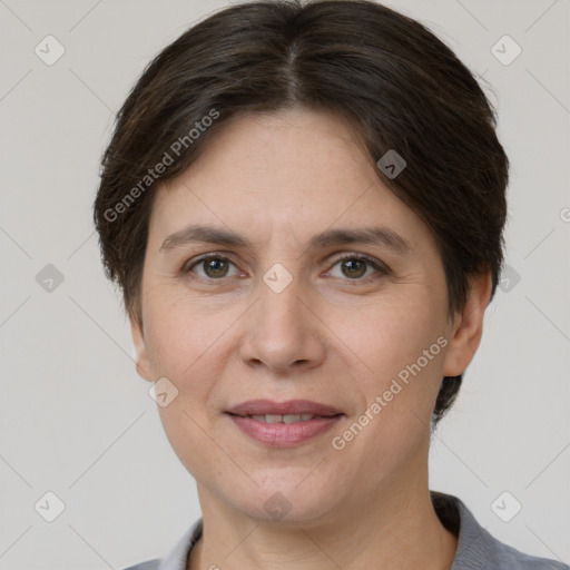 Joyful white adult female with short  brown hair and brown eyes