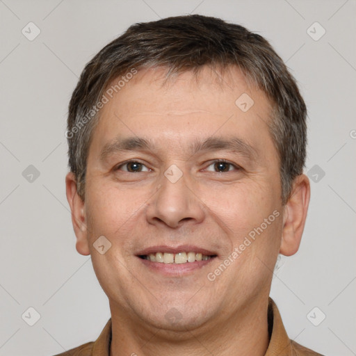 Joyful white adult male with short  brown hair and brown eyes