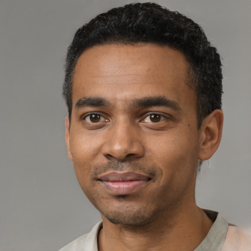 Neutral black young-adult male with short  black hair and brown eyes