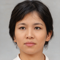 Neutral asian young-adult female with medium  brown hair and brown eyes