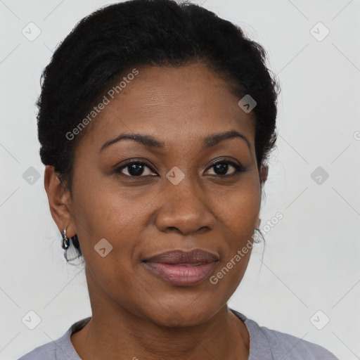 Joyful black adult female with short  black hair and brown eyes