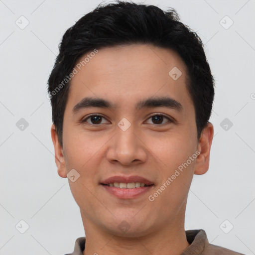 Joyful white young-adult male with short  black hair and brown eyes