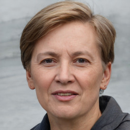 Joyful white adult female with short  brown hair and grey eyes