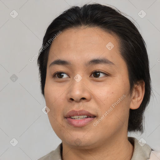 Joyful asian young-adult female with medium  brown hair and brown eyes