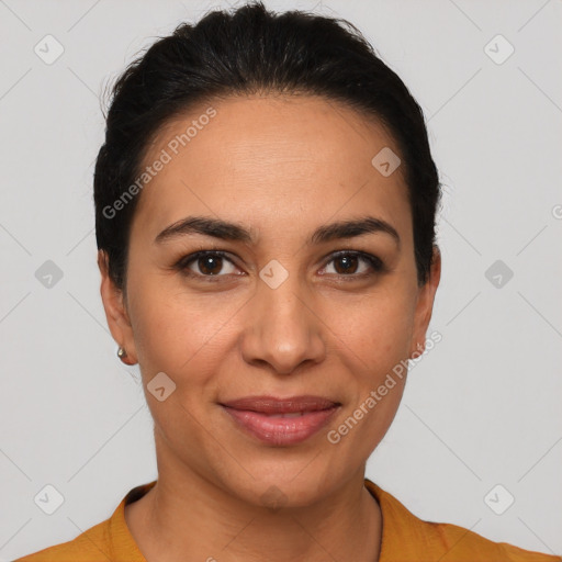 Joyful latino young-adult female with short  brown hair and brown eyes