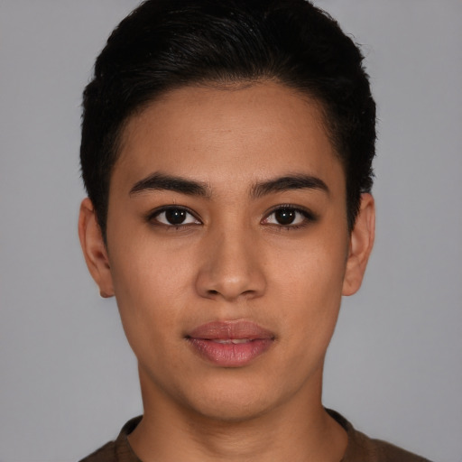 Joyful latino young-adult female with short  black hair and brown eyes