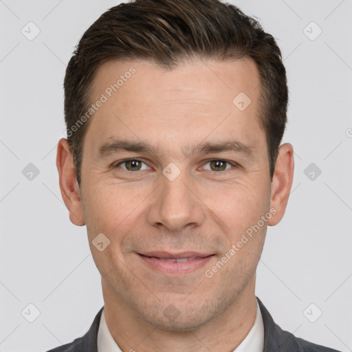 Joyful white adult male with short  brown hair and brown eyes