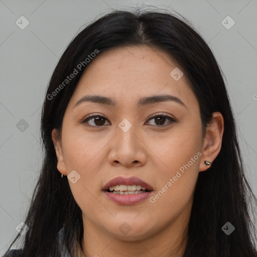 Joyful asian young-adult female with long  brown hair and brown eyes