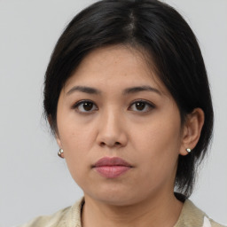 Neutral asian young-adult female with medium  brown hair and brown eyes