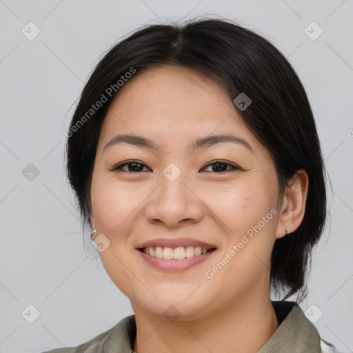 Joyful asian young-adult female with medium  brown hair and brown eyes