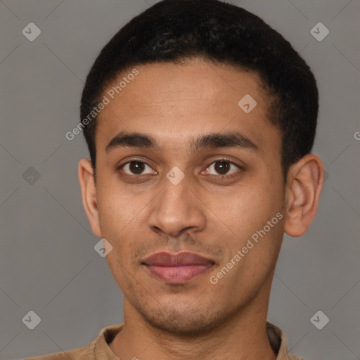Joyful latino young-adult male with short  brown hair and brown eyes