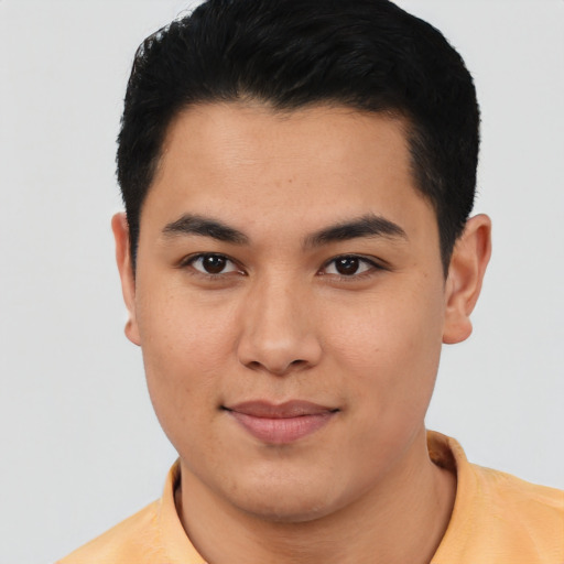 Joyful asian young-adult male with short  black hair and brown eyes