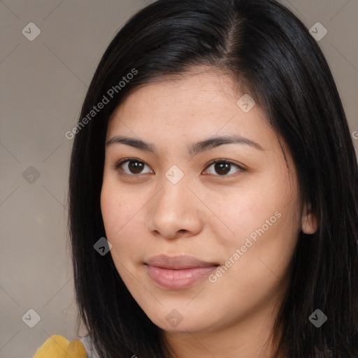 Joyful asian young-adult female with long  brown hair and brown eyes