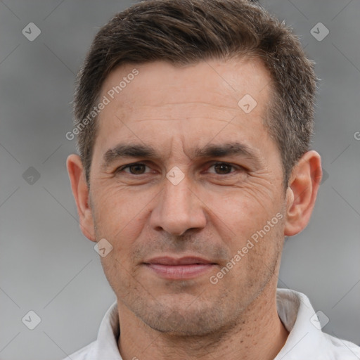 Joyful white adult male with short  brown hair and brown eyes