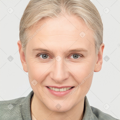 Joyful white adult female with short  brown hair and grey eyes