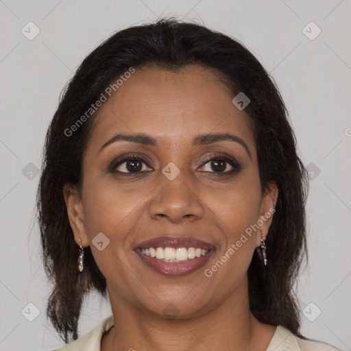 Joyful black young-adult female with medium  brown hair and brown eyes