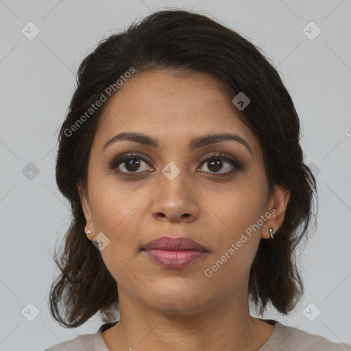 Joyful black young-adult female with medium  brown hair and brown eyes