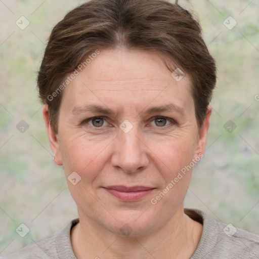 Joyful white adult female with short  brown hair and grey eyes