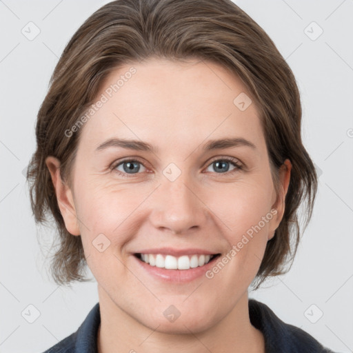 Joyful white young-adult female with medium  brown hair and grey eyes