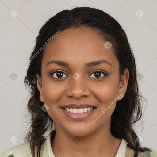 Joyful black young-adult female with medium  brown hair and brown eyes