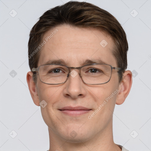 Joyful white adult male with short  brown hair and grey eyes