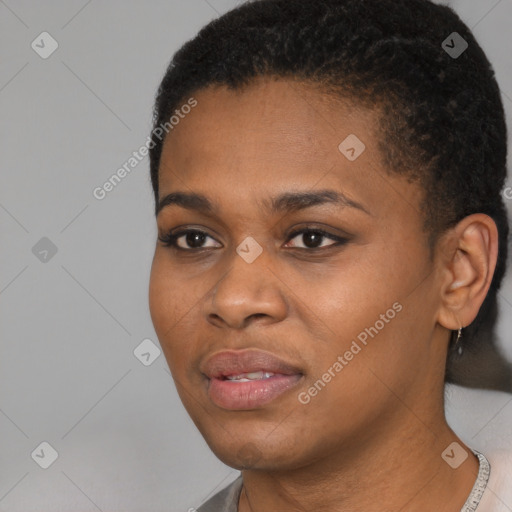 Joyful black young-adult female with short  black hair and brown eyes