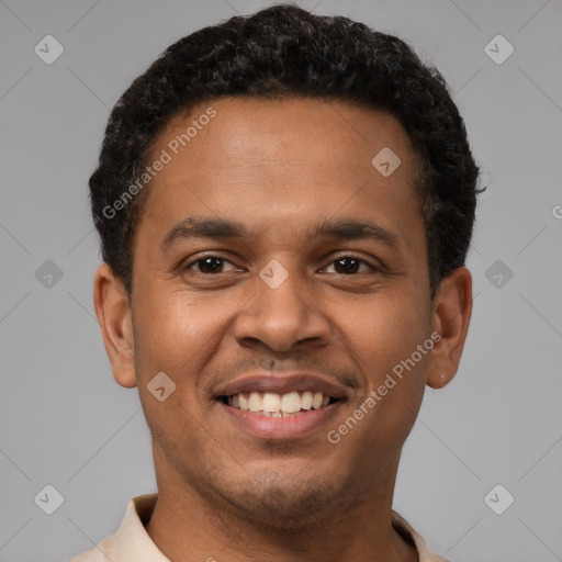 Joyful latino young-adult male with short  brown hair and brown eyes