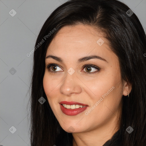 Joyful latino young-adult female with long  brown hair and brown eyes